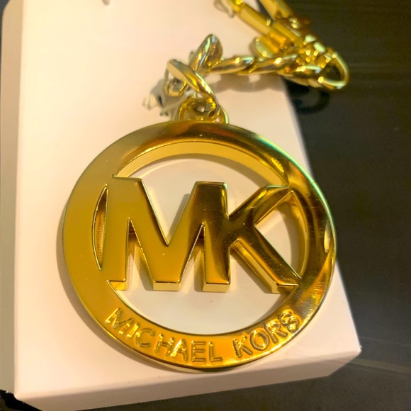 Michael Kors gold purse charm